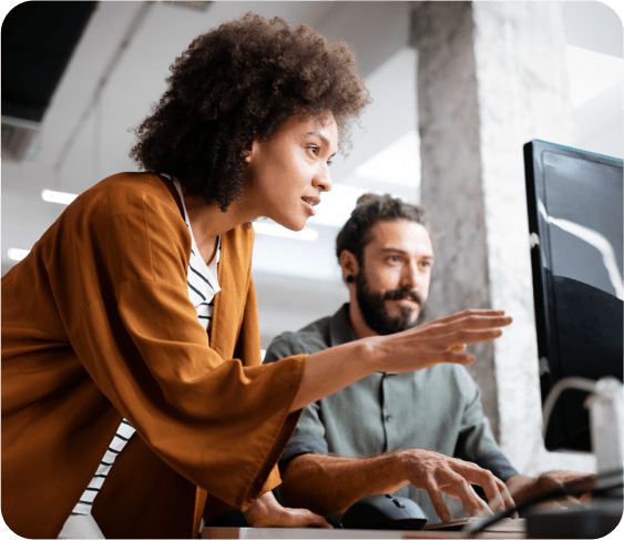 guy and girl at computer monitor